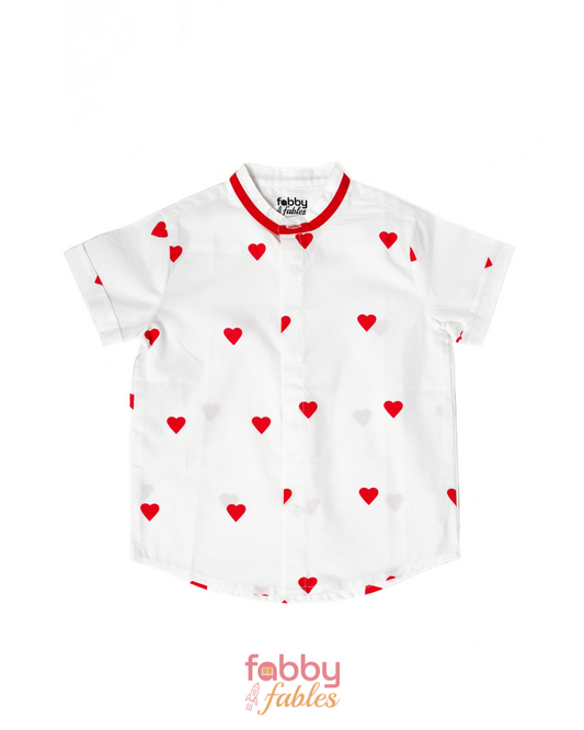 White shirt with red heart patterns on a white background, featuring the brand 'Fabby Fables'