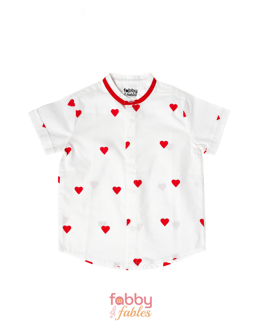 White shirt with red heart patterns on a white background, featuring the brand 'Fabby Fables'
