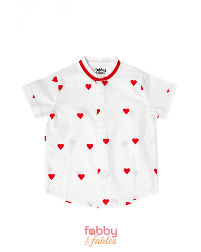 White shirt with red heart patterns on a white background, featuring the brand 'Fabby Fables'